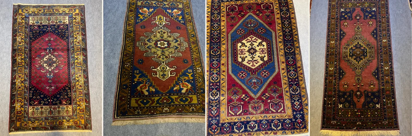 Yan yana lacivert, kiremit ve bordo zeminli Yahyalı desenli halılar ile somon zeminli yolluk